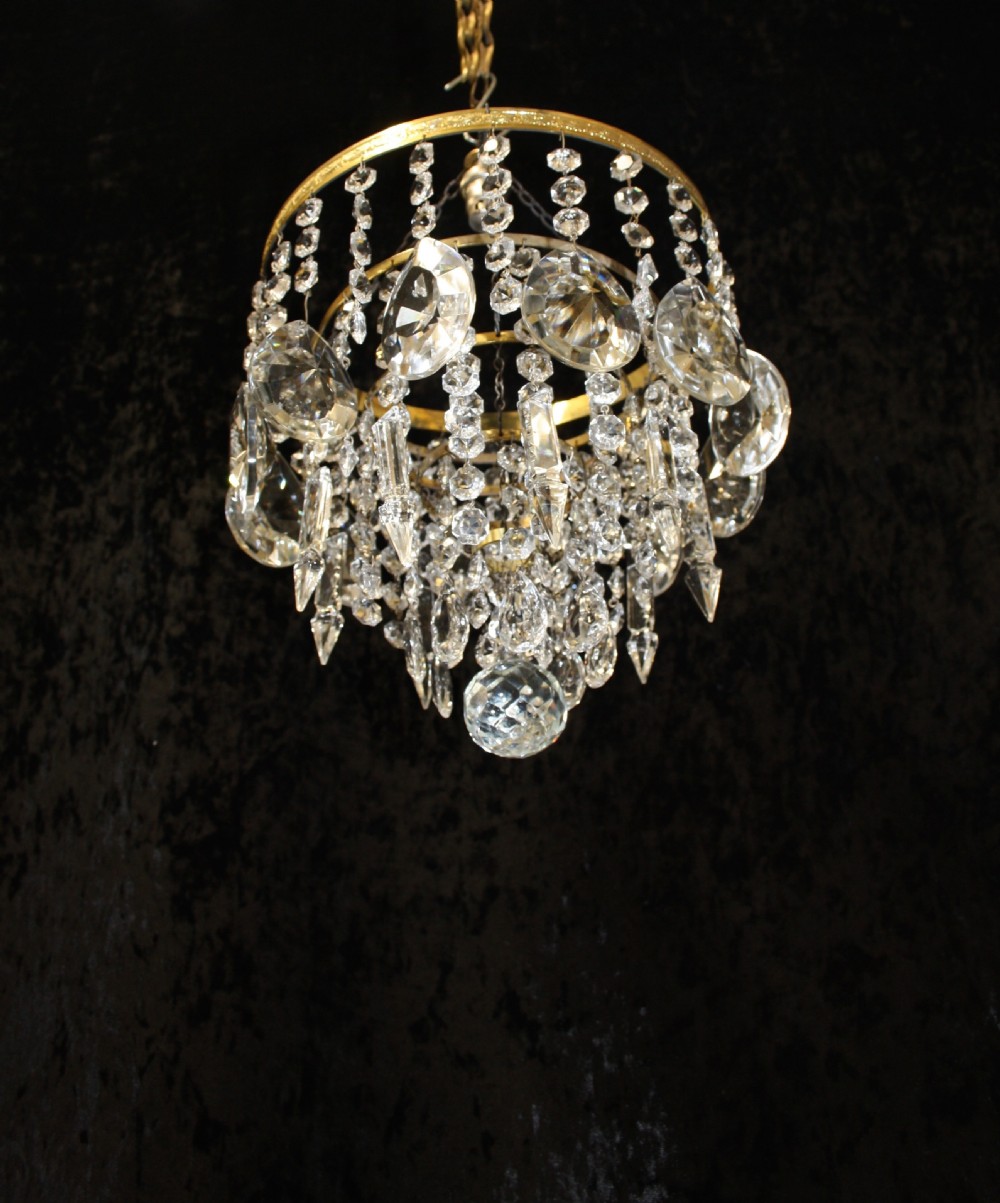 Gilt brass chandelier with unusually large drips to the top. View VII
