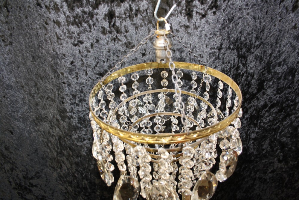 Gilt brass chandelier with unusually large drips to the top. View VIII