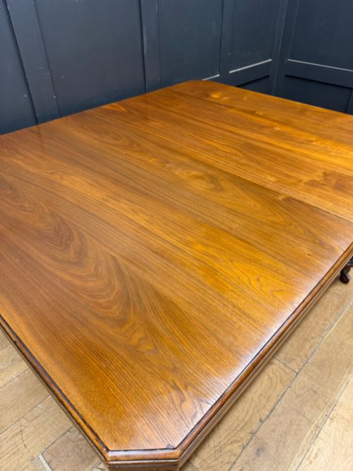 fig 4. A solid walnut Victorian extending dining table with reeded turned legs set on brass castors.