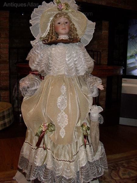 HUGE PORCELAIN DOLL LIFE SIZE WITH PATENT CLOSING EYES HAND MADE CLOTHES