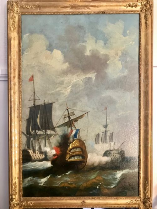 fig 3. A tall rectangular French trumeau mirror with a gilded frame containing an upper oil painting of a naval seascape and a lower mirror glass section.