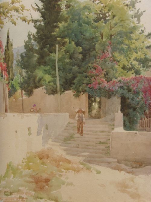 fig 1. A framed Edwardian watercolour painting depicting a sunny Lake Como shore with lush green trees, stone steps, and distant mountains enclosed in an ornate gold gilt frame.
