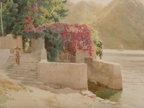 fig 4. A framed Edwardian watercolour painting depicting a sunny Lake Como shore with lush green trees, stone steps, and distant mountains enclosed in an ornate gold gilt frame.