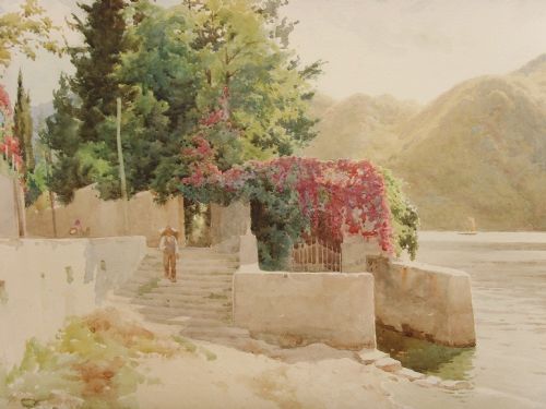 fig 7. A framed Edwardian watercolour painting depicting a sunny Lake Como shore with lush green trees, stone steps, and distant mountains enclosed in an ornate gold gilt frame.
