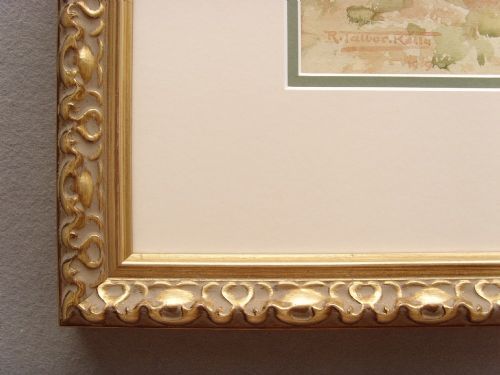 fig 9. A framed Edwardian watercolour painting depicting a sunny Lake Como shore with lush green trees, stone steps, and distant mountains enclosed in an ornate gold gilt frame.