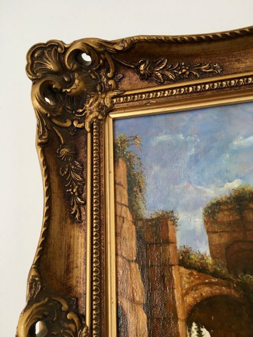 fig 6. An oil painting on canvas depicting classical Italian architectural ruins along a Mediterranean coastline within an ornate gold gilt frame.