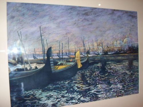 fig 1. A framed artwork depicting gondolas docked along the Venetian Grand Canal at twilight, presented in a wide cream mount and gilt gold frame.