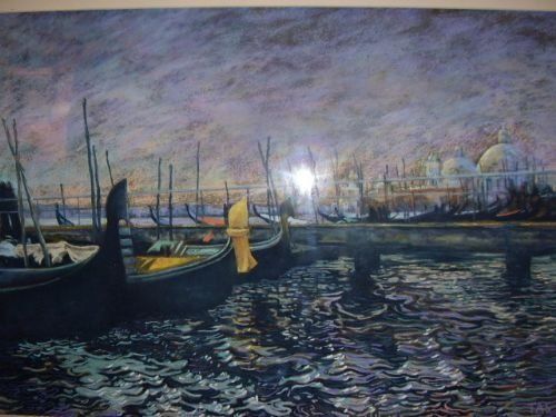 fig 2. A framed artwork depicting gondolas docked along the Venetian Grand Canal at twilight, presented in a wide cream mount and gilt gold frame.