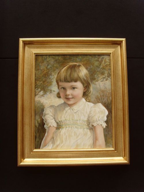 fig 6. A late nineteenth-century oil portrait depicting a young child in a smocked white dress set within a gilded frame.
