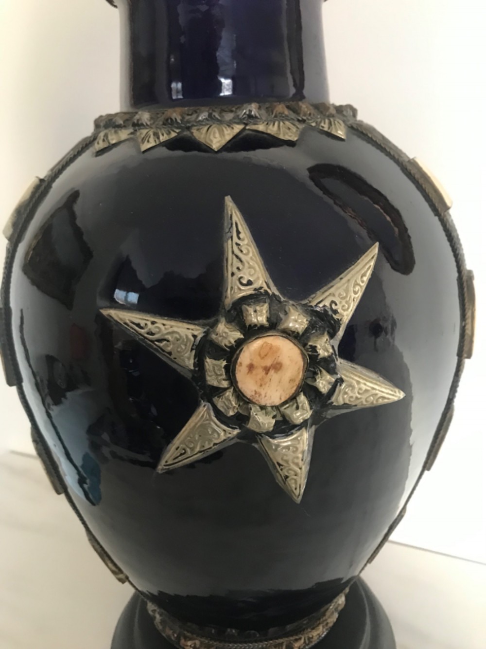 A cobalt blue glazed terracotta vase featuring silver-tone metal mounts, bone inlay strips, a star motif, and a black base. View IV