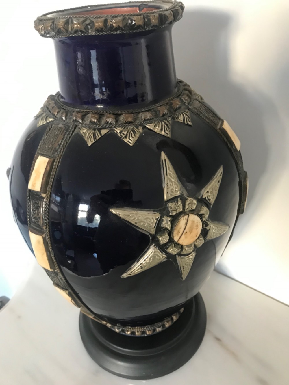 A cobalt blue glazed terracotta vase featuring silver-tone metal mounts, bone inlay strips, a star motif, and a black base. View VII