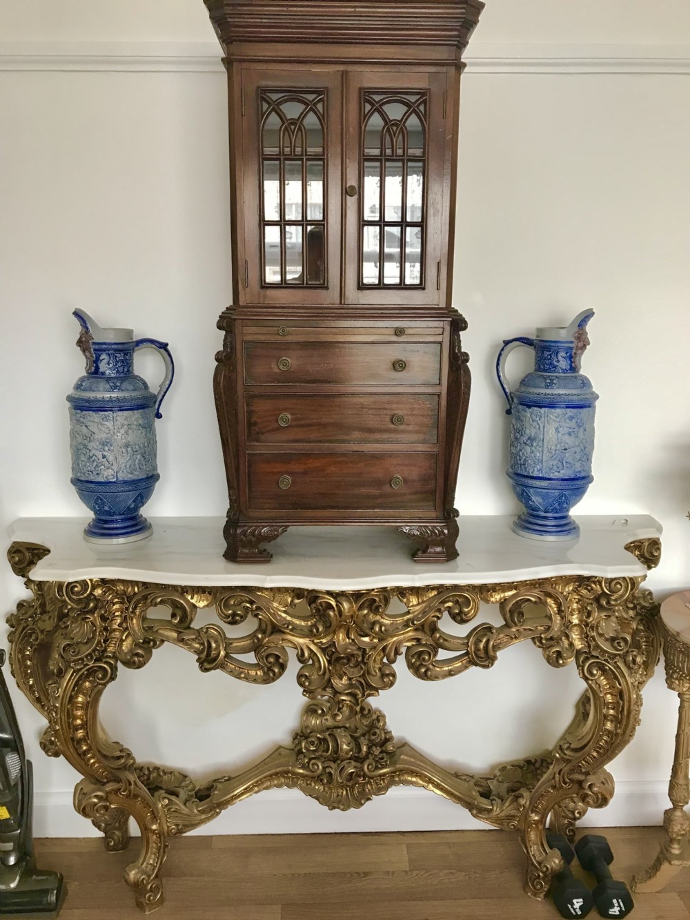 A miniature mahogany bureau bookcase featuring glazed upper doors with gothic style astragal glazing, drawer base, and bracket feet.