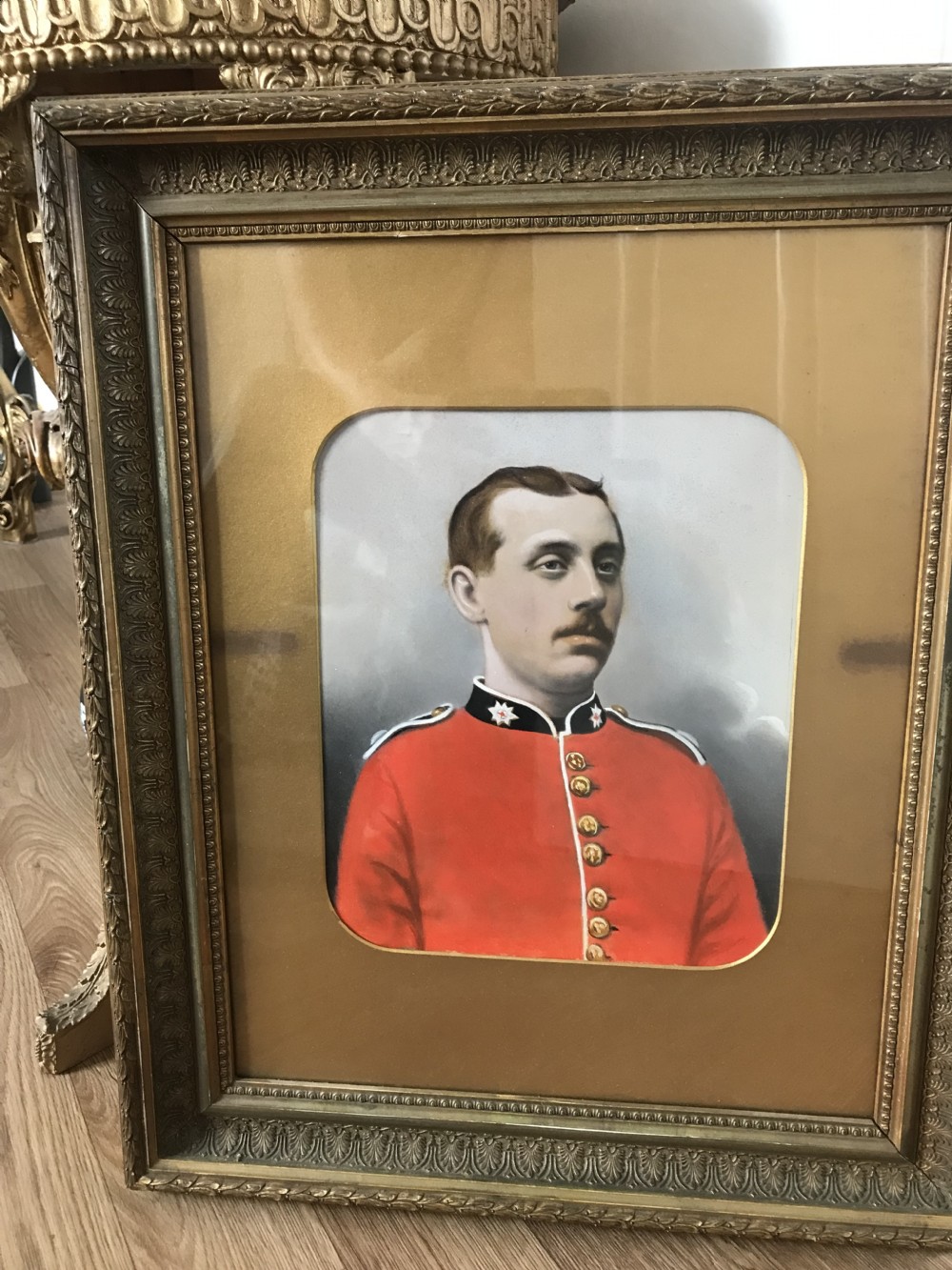 A 19th-century framed oil portrait of a Coldstream Guardsman wearing a scarlet red uniform tunic with gold buttons and a black collar. View VIII
