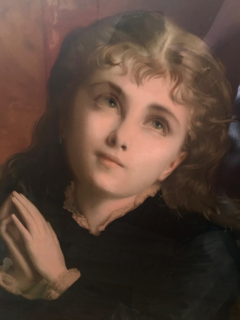 A 19th-century oleograph portrait of Mary Magdalene with clasped hands in prayer, presented inside a deep moulded gold frame under glass. View II
