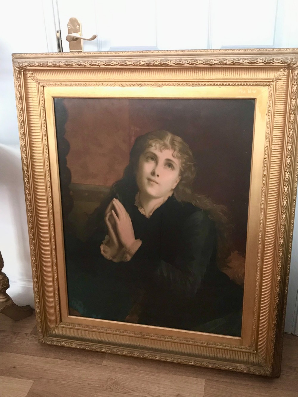 A 19th-century oleograph portrait of Mary Magdalene with clasped hands in prayer, presented inside a deep moulded gold frame under glass. View III