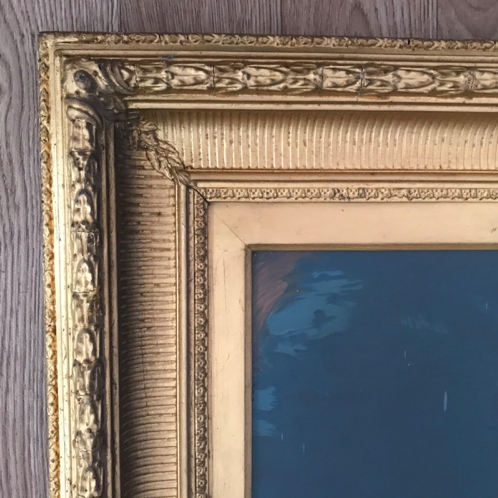 A 19th-century oleograph portrait of Mary Magdalene with clasped hands in prayer, presented inside a deep moulded gold frame under glass. View VI