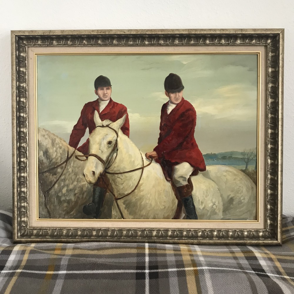 An oil painting framed in silver-toned carved wood depicting two horse riders in red coats mounted on grey horses. View II