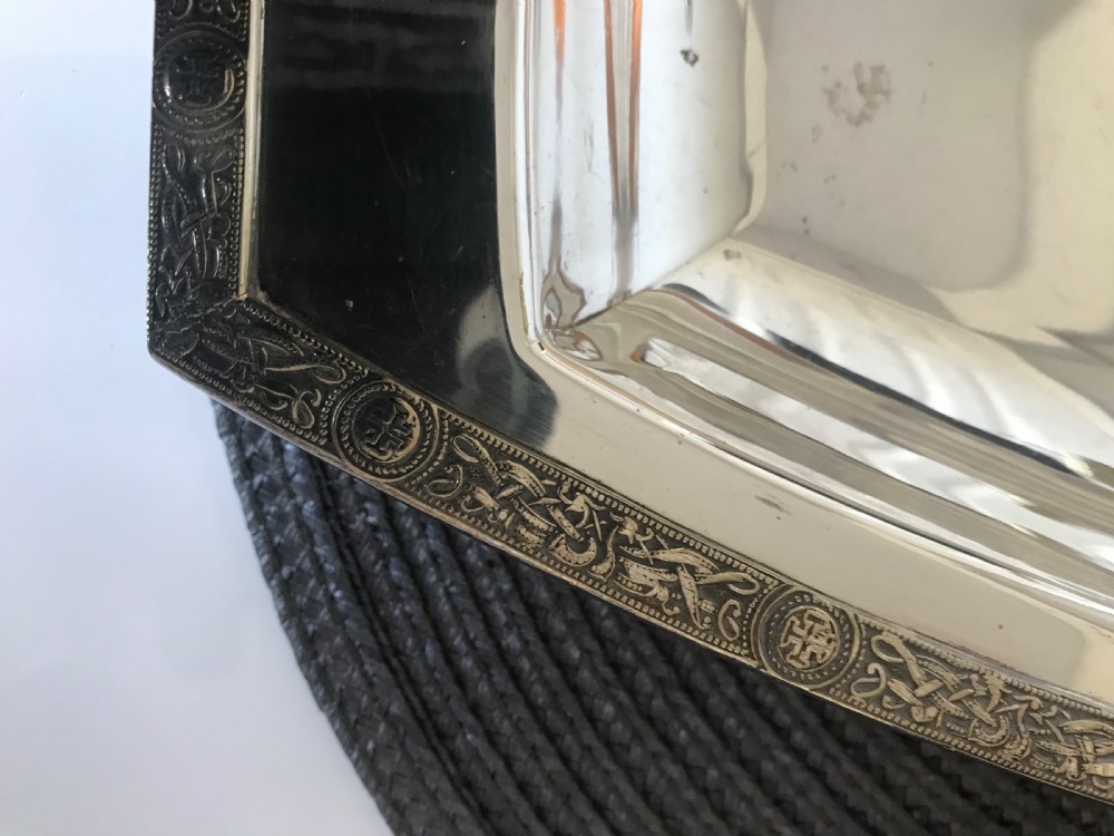 A boat-shaped silver-plated vegetable tureen with a fitted lid and side handles. View V