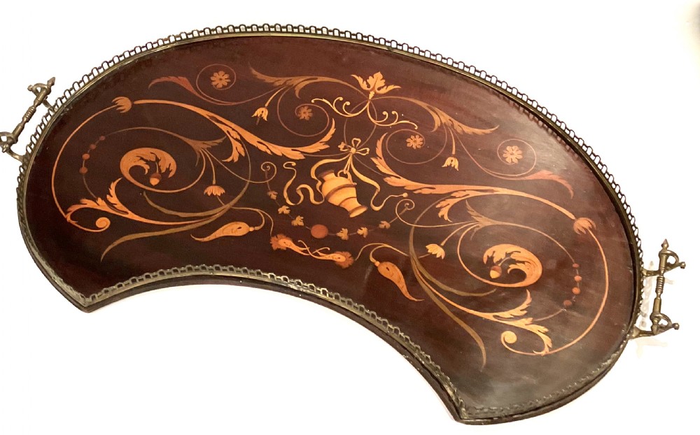 A crescent-shaped mahogany tray featuring inlaid botanical marquetry, a central urn motif, and a pierced brass gallery rim with handles. View II