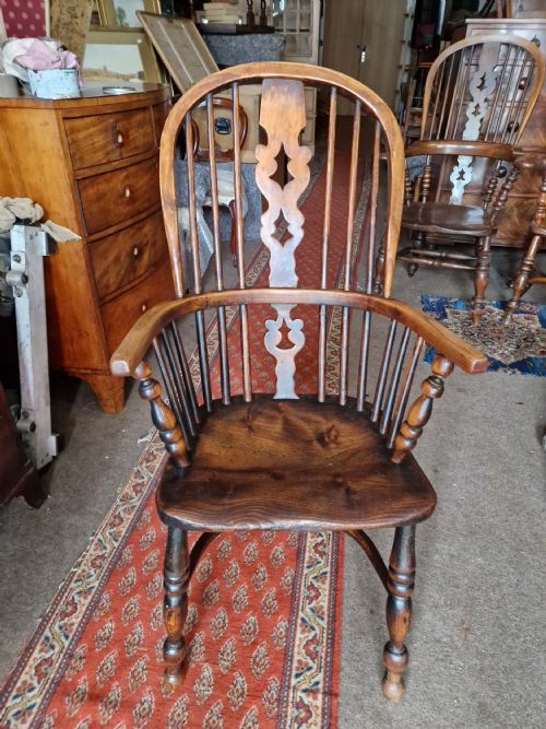 Antique Windsor Armchair with Crinoline Stretcher .