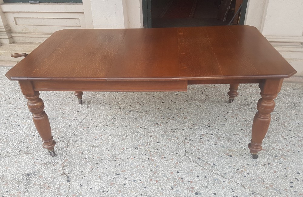   ANTIQUE OAK EXTENDING TABLE  View II