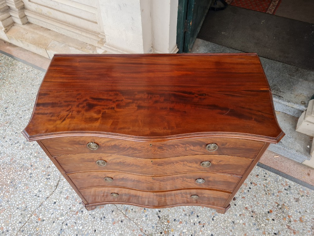 ANTIQUE MAHOGANY SEPENTINE CHEST OF DRAWERS View II