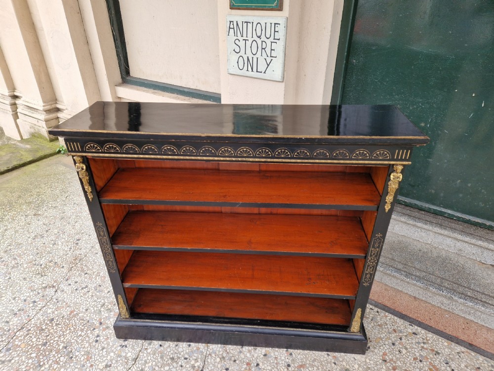   A VICTORIAN EBONISED OPEN BOOKCASE BY EDWARDS AND ROBERTS  View II