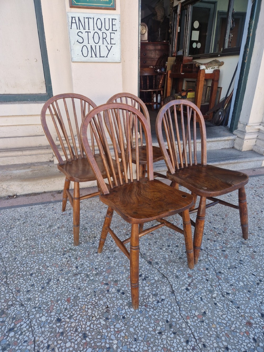 SET OF FOUR WHEEL BACK CHAIRS 