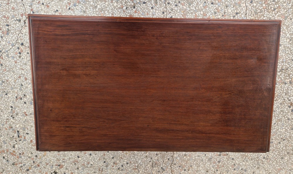 An 18th-century Georgian mahogany kneehole desk featuring a long top drawer, six flank drawers, a central recessed cupboard, brass drop handles, and bracket feet. View III