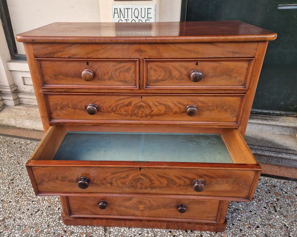 A tall Victorian mahogany chest of drawers featuring two short upper drawers above four long graduating drawers with turned wooden knobs and a plinth base. View VIII