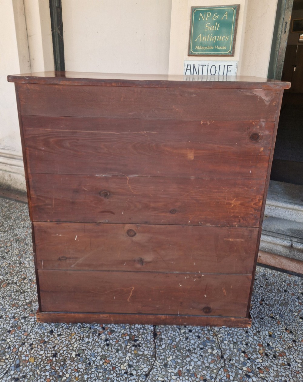 A tall Victorian mahogany chest of drawers featuring two short upper drawers above four long graduating drawers with turned wooden knobs and a plinth base. View XI