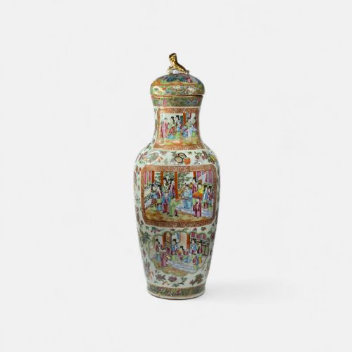 fig 1. A 19th-century Cantonese Rose Mandarin porcelain baluster vase decorated with narrative figure panels, floral enamel borders, and a domed cover topped with a gilt foo dog finial.