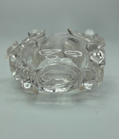 fig 2. A 19th-century Chinese carved clear rock crystal snuff bottle featuring openwork prunus branches around the body and a smooth matching stopper.