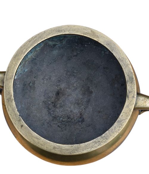 fig 6. An 18th-century Chinese bronze censer featuring a rounded bombe body, flared rim, splayed foot ring, and two loop handles.