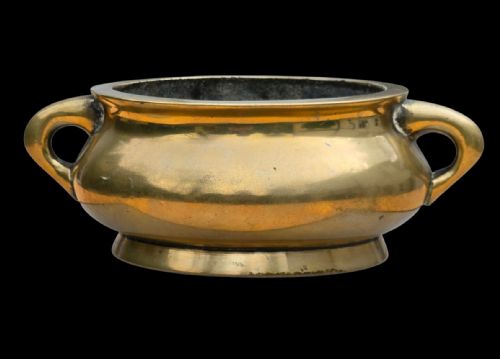 fig 1. An 18th-century Chinese bronze censer featuring a rounded bombe body, flared rim, splayed foot ring, and two loop handles.