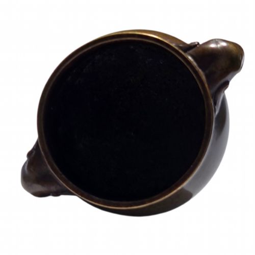 fig 5. A miniature dark bronze censer featuring a rounded body, twin elephant head handles with curved trunks, and a circular raised footring.