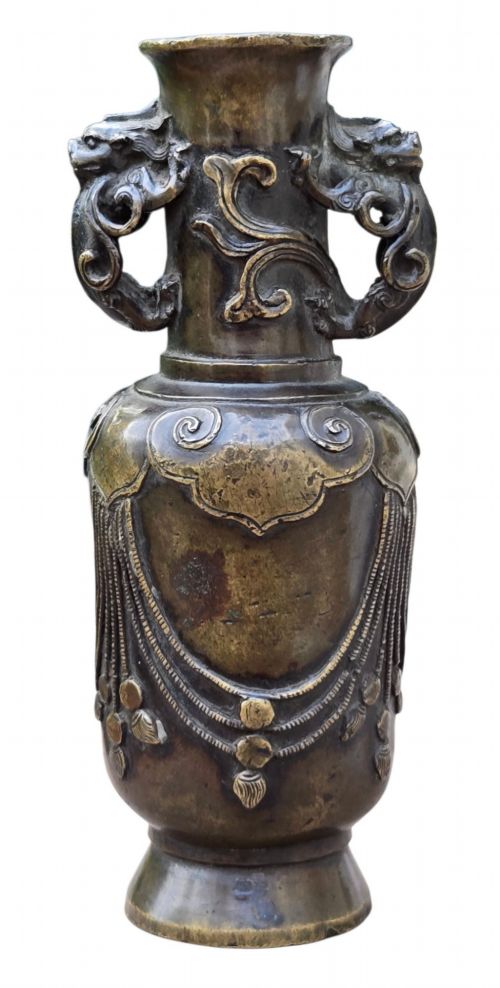 fig 1. A patinated cast bronze Chinese vase featuring stylised dragon-head handles and raised Yingluo beaded tassels.