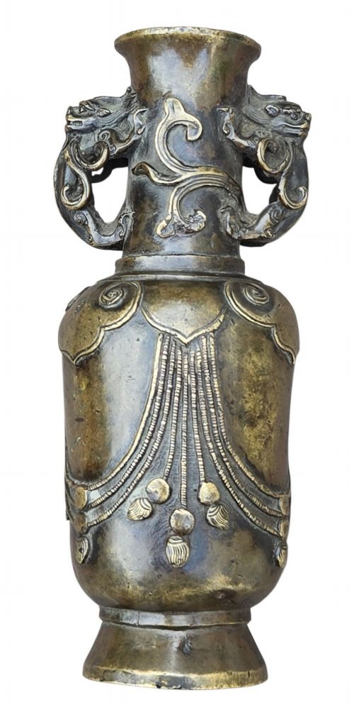 fig 6. A patinated cast bronze Chinese vase featuring stylised dragon-head handles and raised Yingluo beaded tassels.