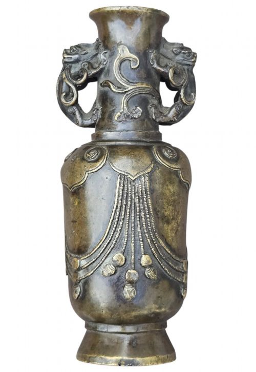 fig 7. A patinated cast bronze Chinese vase featuring stylised dragon-head handles and raised Yingluo beaded tassels.