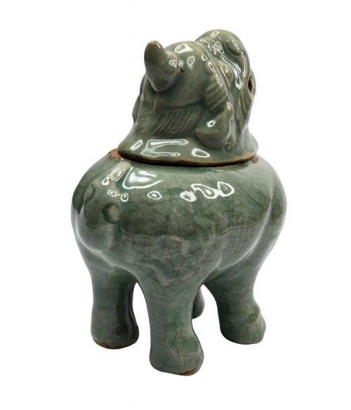 fig 5. A celadon-glazed ceramic incense burner formed as a quadruped mythical creature with a removable head serving as the lid.
