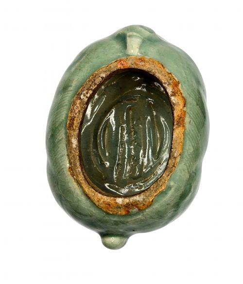 fig 7. A celadon-glazed ceramic incense burner formed as a quadruped mythical creature with a removable head serving as the lid.