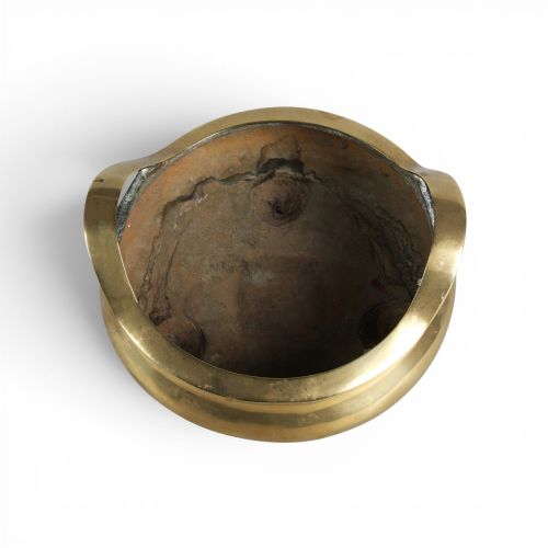 fig 3. A heavy gold-toned cast bronze tripod censer featuring two upright loop handles and conical feet.