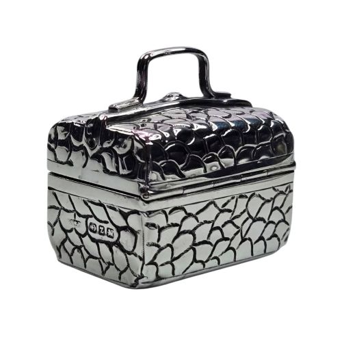 fig 1. A late Victorian sterling silver novelty box crafted in the form of a miniature trunk with embossed crocodile skin texture and a top carrying handle.