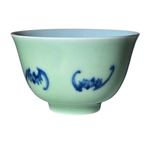 fig 3. A small Chinese celadon green glazed porcelain cup decorated with underglaze blue bat motifs around the exterior.