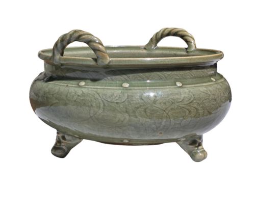 fig 6. A green glazed Longquan celadon tripod censer with carved floral scrollwork beneath the glaze, twin rope-twist handles, and three mask feet.