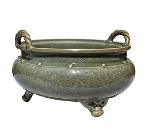 fig 9. A green glazed Longquan celadon tripod censer with carved floral scrollwork beneath the glaze, twin rope-twist handles, and three mask feet.