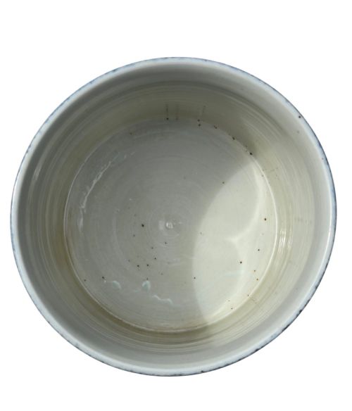 fig 7. A cylindrical Chinese porcelain brush pot featuring a mottled powder-blue glaze with a pale rim.