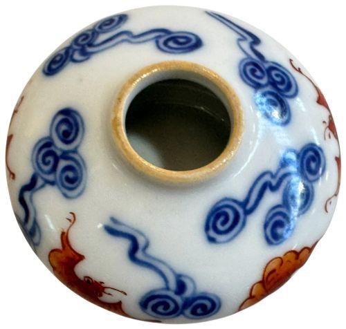 fig 4. A squatted Chinese porcelain brush washer decorated with underglaze cobalt blue clouds and copper red bats on a white glazed ground.