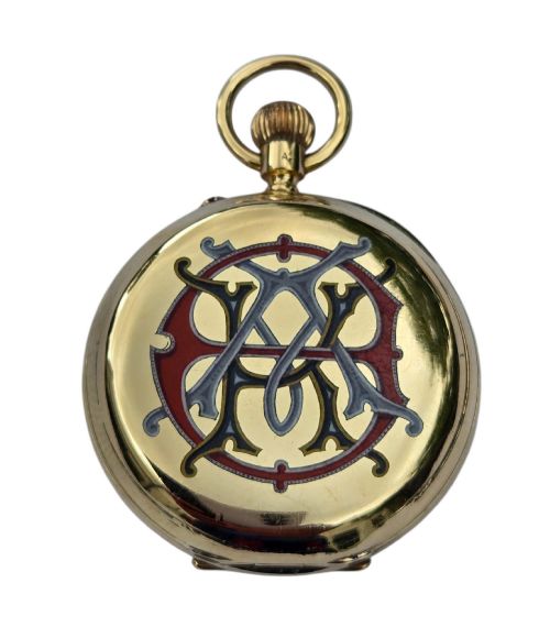 fig 6. An 18-karat gold Victorian pocket watch casing displaying a polychrome enamelled coat of arms flanked by griffin supporters and a heraldic motto banner.