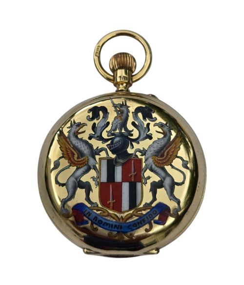 fig 8. An 18-karat gold Victorian pocket watch casing displaying a polychrome enamelled coat of arms flanked by griffin supporters and a heraldic motto banner.